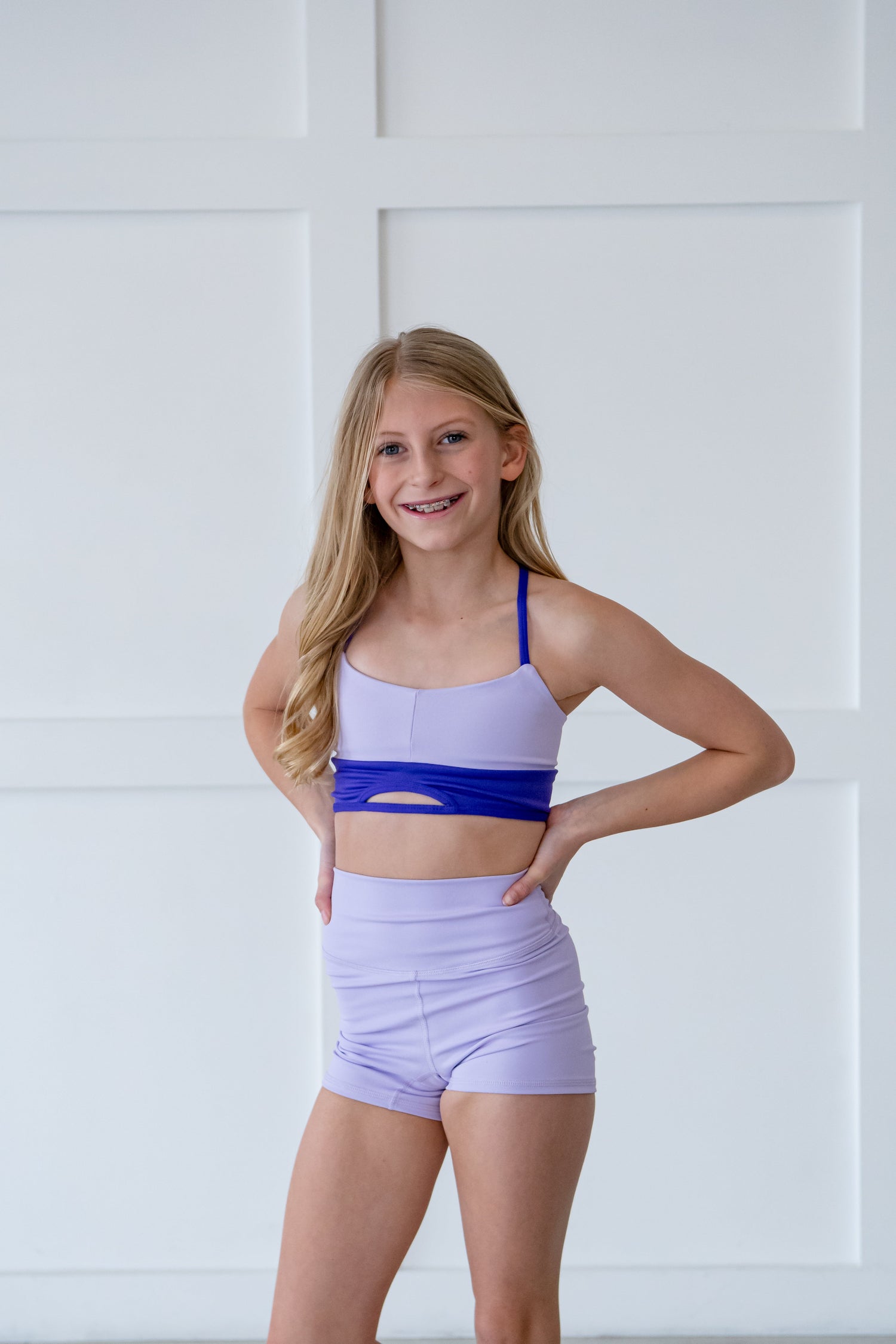 Girl in light purple high waist dance shorts